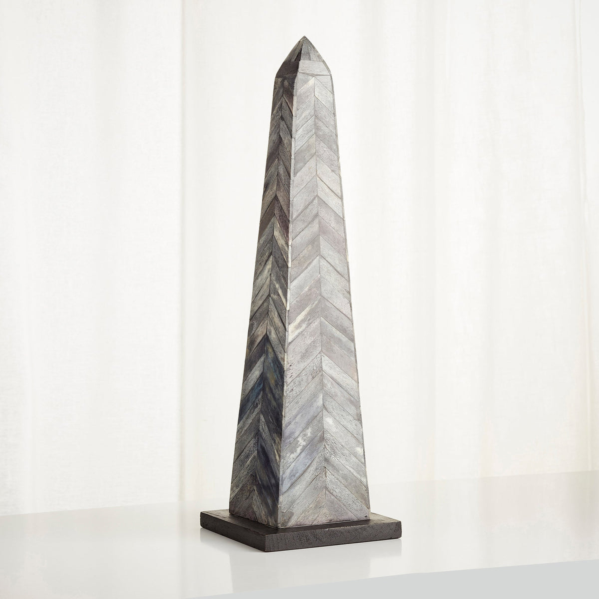 Herring Obelisk Sculpture by Cyan